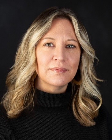 Headshot of Rachel Louise Strong on a black background
